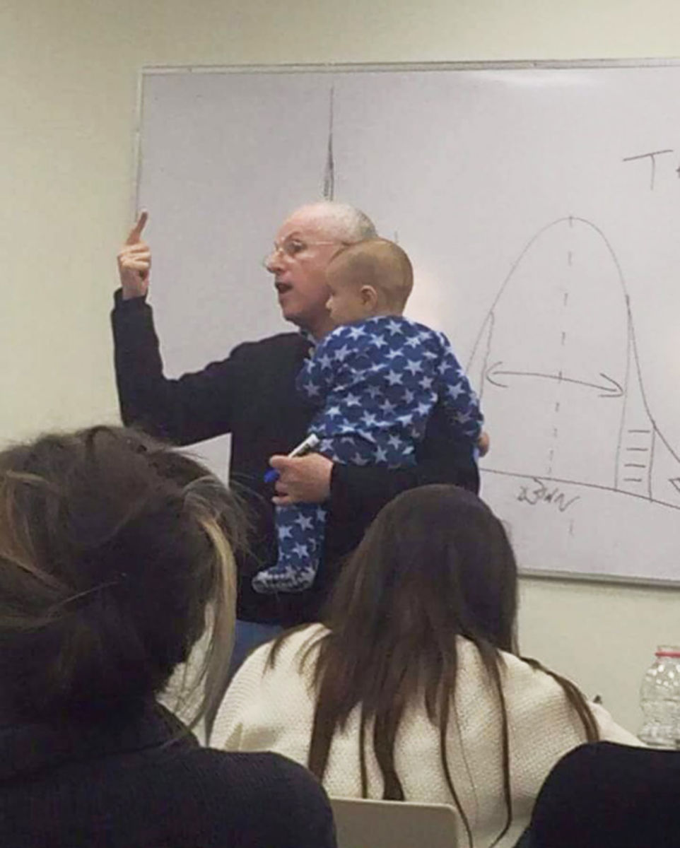 lecturer_soothes_crying_baby_professor_sydney_engelberg_hebrew_university_1